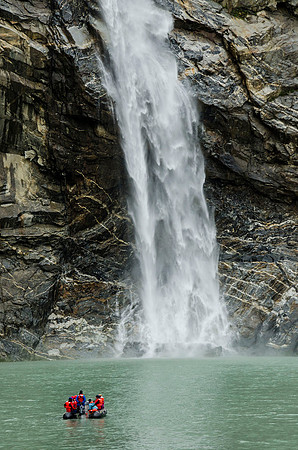 Dwarfed by a waterfall