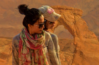 Two Chinese models at Delicate Arch, Utah
