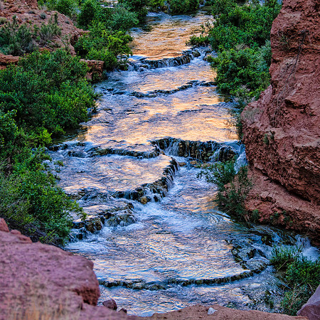 Travertine terraces reflecting canyon walls